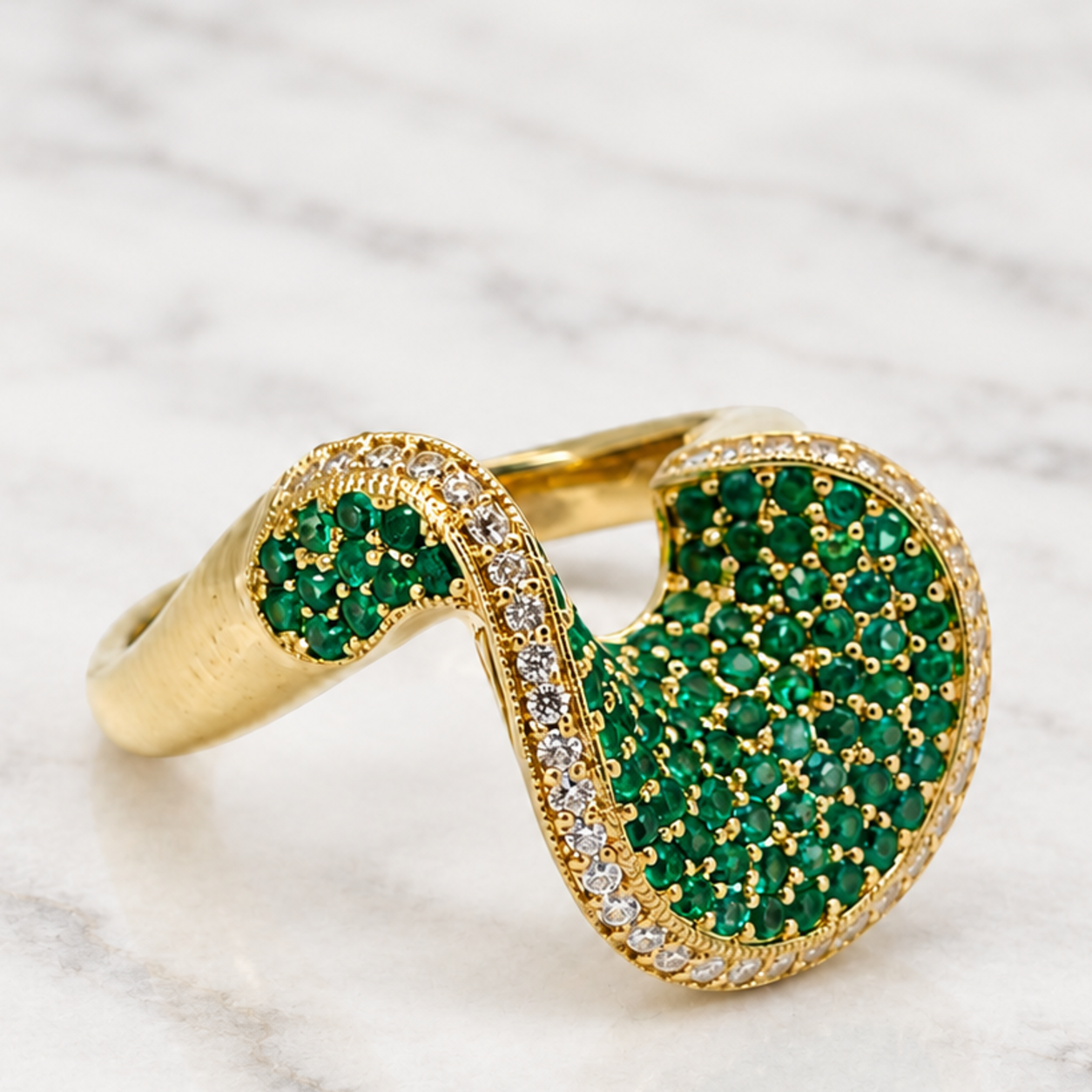 Gold statement ring set with green gemstones and diamonds manufactured by BCJExport